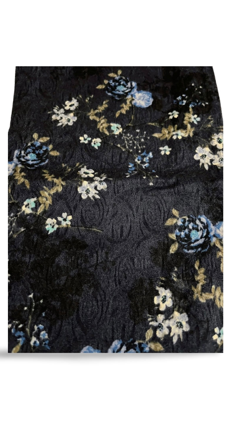 Blue trousers with floral decoration